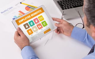 A person looks at an array of employee benefits options on a tablet screen.